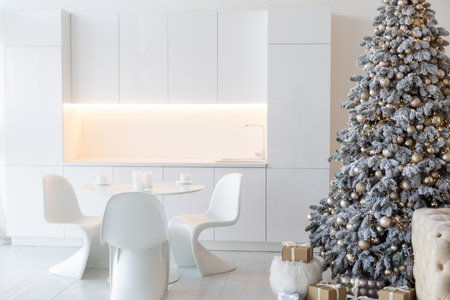 Christmas tree with presents underneath in living roomの写真素材