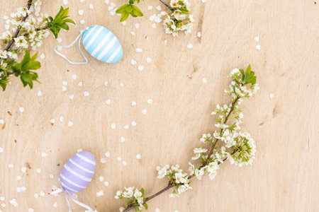 A Easter egg on a branch of a blooming cherry tree. Easter spring background