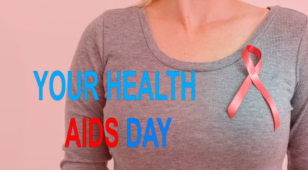 Red ribbon. Concept for World AIDS Day. black background, copy space. words World AIDS Action Day.