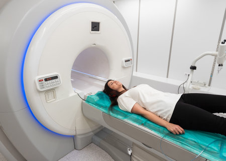 Female patient undergoing MRI - Magnetic resonance imaging in Hospital. Medical Equipment and Health Careの写真素材