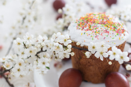Easter cake and painted eggs blooming branch