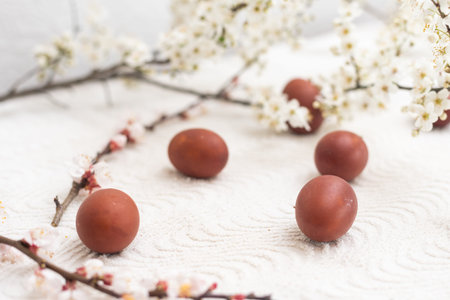 Colorful Easter eggs with spring blossom flowers. Colored Egg Holiday border. Easter cake