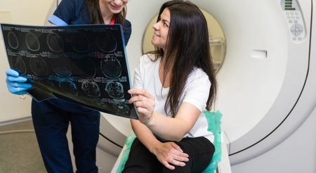 Beautiful female radiologist looking at the MRI scan images