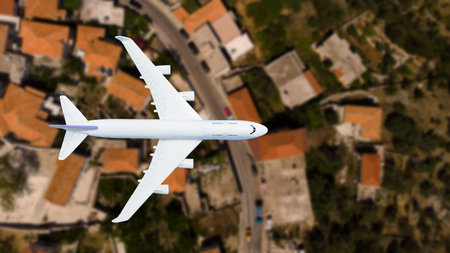 airplane flying over the city