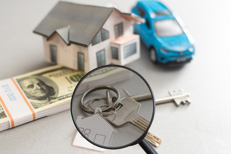 Find a home or a flat concept. Toy model house under magnifying glass. Rent apartments, Real Estate and buying a house ideaの写真素材