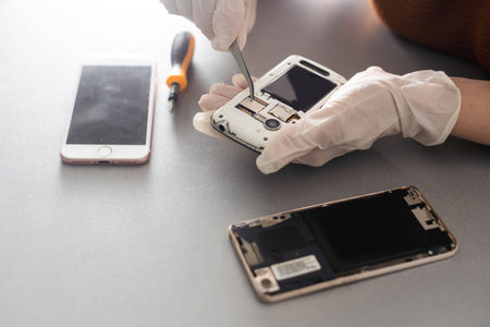 Close-up photos showing process of mobile phone repair