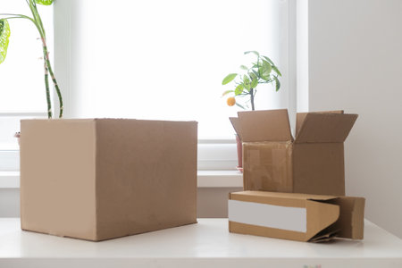 Opened brown gift box on wooden backgroundの写真素材