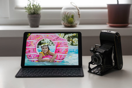 office photography desk table with laptop, tablet, camera. Top view with copy space