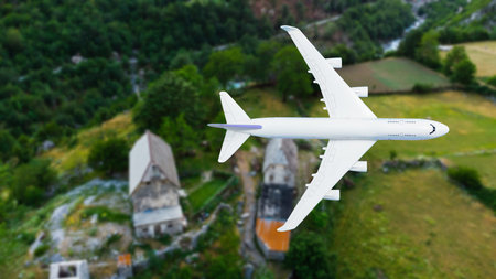 airplane flying over the cityの写真素材