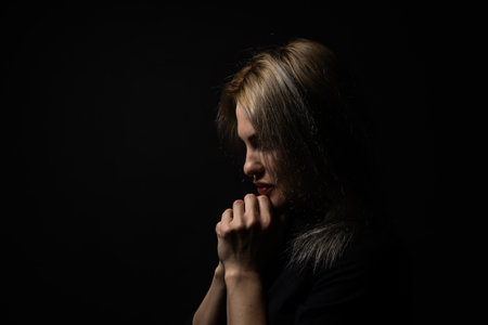Woman hands praying to god. Woman Pray for god blessing to wishing have a better life. begging for forgiveness and believe in goodness. Christian life crisis prayer to god.の写真素材