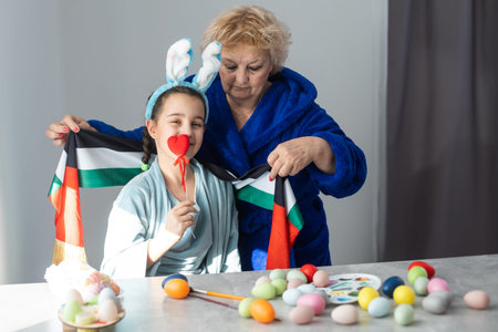 grandmother and granddaughter with uae flag for easter