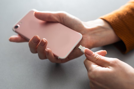 holding charging smartphone quick charge fast chargeの写真素材