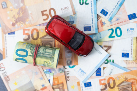 concept of car loan, Rent, car insurance, buy car Toy car and money.の写真素材