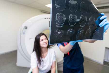 Young doctor looking at computed tomography x-ray image