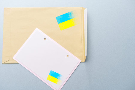 Envelope and the Ukrainian flag. Stop the war concept isolated background.