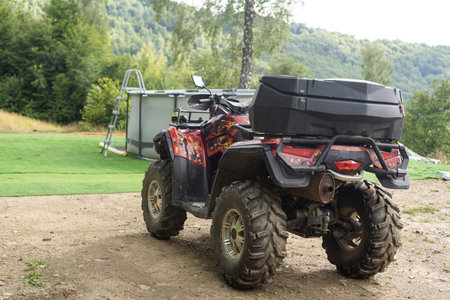 ATV Quad Bike in front of mountains landscape.