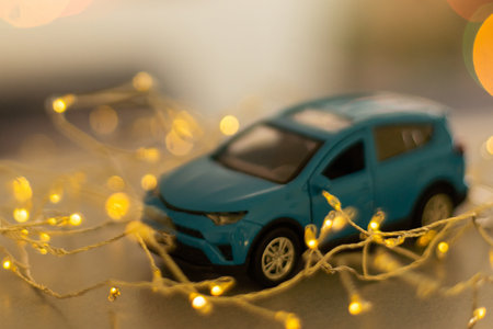 toy car on christmas lights background. new yearの写真素材