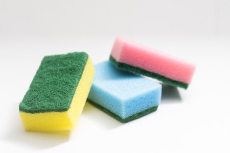 Multi-colored sponges for dishes Isolated on a white background.の写真素材