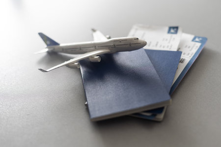 Airline tickets and documents on wooden table, top viewの写真素材