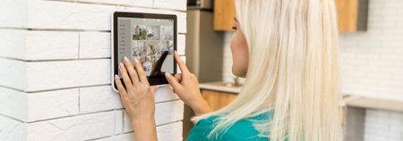 Woman using smart wall home control system