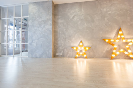 Decorative star with lamps on a background of wall. Modern grungy interiorの写真素材