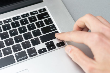 Pressing enter button on the computer keyboard