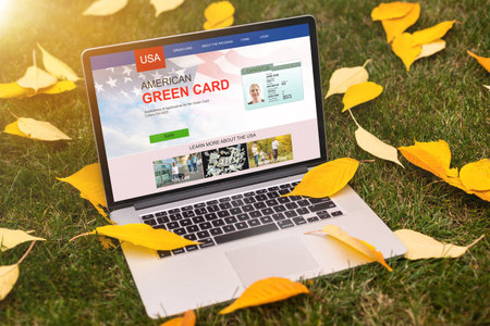 laptop with green cards Applicationの写真素材