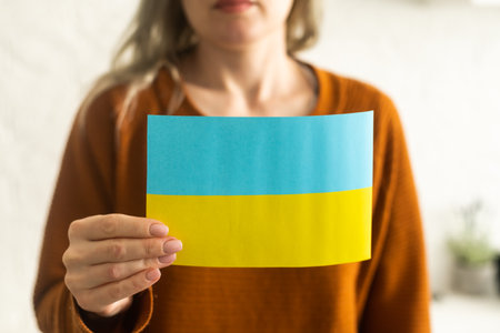 Ukrainian flag in hands, freedomの写真素材