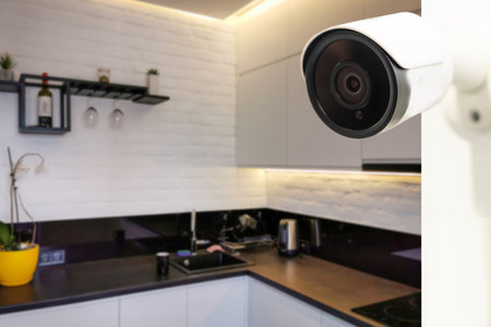 Close Up Object Shot of a Modern WiFi Surveillance Camera on a White Wall in a Cozy Apartment