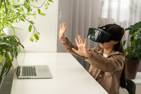 technology, augmented reality, entertainment and people concept - happy girl teenager in virtual...