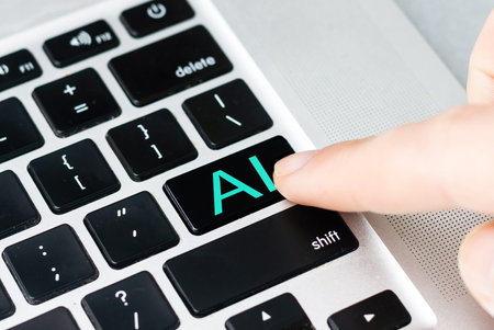 hand pressing a keyboard on a laptop Robotic AI