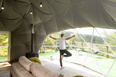 men meditate and yoga at glamping for good health.の写真素材