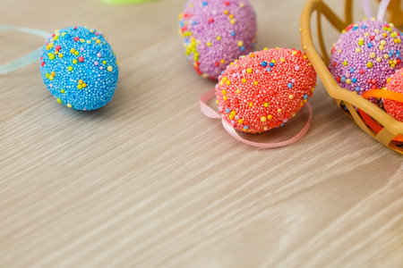 Painted Easter eggs in a wicker plate. The concept of celebrating Easter.