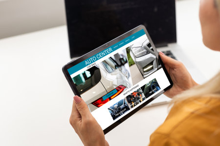 automobile sales center, Laptop screen displaying a car sale conceptの写真素材