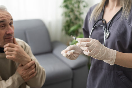 elderly man getting virus vaccineの写真素材