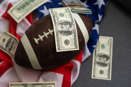 rugby ball and dollars with usa flagの写真素材