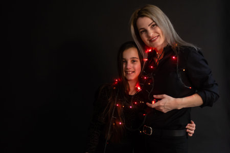 happy Christmas. family mother and kid with Christmas garland