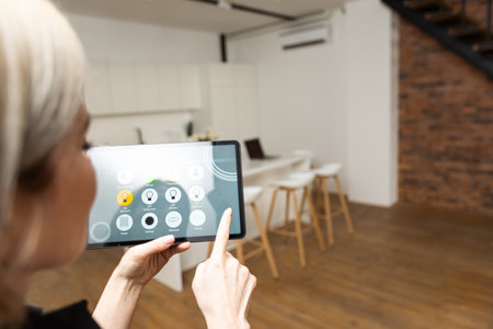 tablet with smart home app in modern roomの写真素材