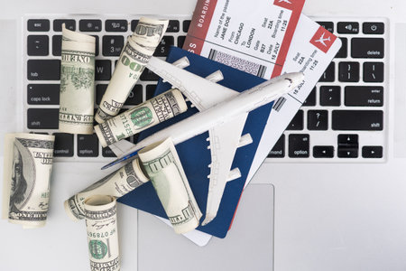 Take your work to new heights with a plane laptop Stay connected and productive while traveling, perfect for busy professionals and digital nomads.の写真素材