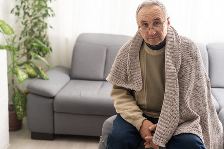 close-up portrait of a senior man thinking about something.の写真素材