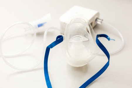 Compressor nebulizer with mask on tableの写真素材