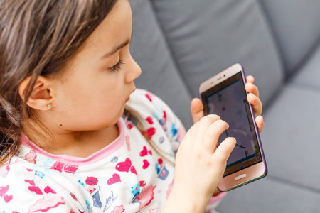 little girl with a smartphone