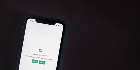 Screen with ChatGPT chat with AI or artificial intelligence. Man search for information using...