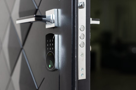 To open the door. Modern white door with chrome metal handle. Elements of interior closeup