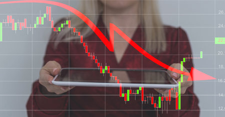 businesswoman standing near virtual screen with stock market changes, business graph chart. Double exposure of lines, growing numbers, online trading.の写真素材