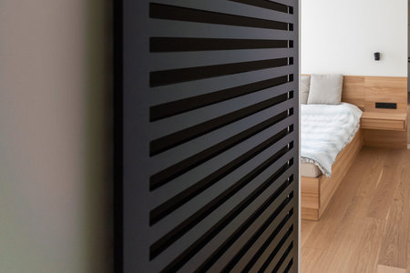 Hotel interior room, Condominium or apartment doorway with open door in front of blur bedroom background.の写真素材