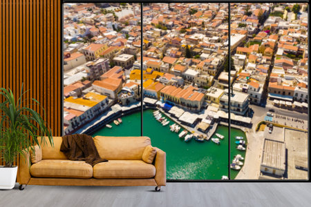 a sofa with a large painting behind it
