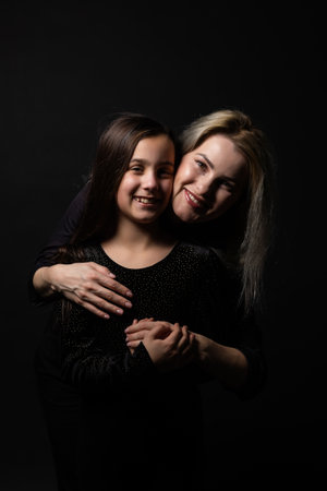 portrait of young woman with her little girlの写真素材