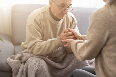 Senior couple, happy and laughing in their home with love, care and support for retirement...
