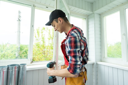 Professional master at repair and installation of windows, changes rubber seal gasket in pvc windows